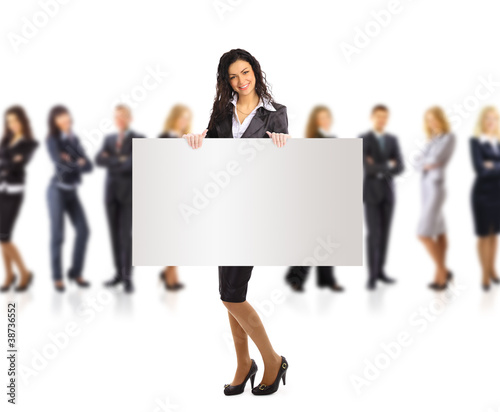 Photo: Business woman and woman and group holding a banner Business woman and woman and group holding a banner