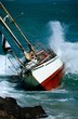Photo: yacht crash on the rocks in stormy weather yacht crash on the rocks in stormy weather