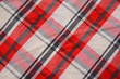 Foto: Background Texture Of A Rumpled Plaid Material Background Texture Of A Rumpled Plaid Material
