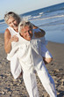 Happy Senior Couple Having Fun on A Tropical Beach