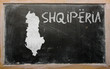 outline map of albania on blackboard