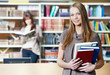 young student girl study with books in library