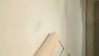 Painting out a bare wall with a paint roller