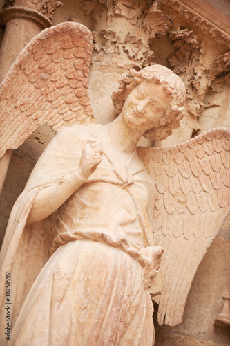 Photo: Famous smiling angel on facade of Reims Cathedral Famous smiling angel on facade of Reims Cathedral