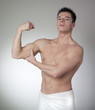 proud man showing up his biceps