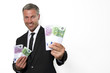 Happy face of mature man with money in hand