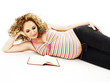 Photo: The pregnant woman reads the book. Isolated on white The pregnant woman reads the book. Isolated on white