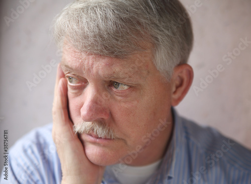 Photo: businessman with a worried, anxious expression businessman with a worried, anxious expression