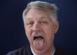 older man showing his tongue older man showing his tongue