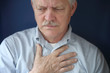 older man feeling pain in chest