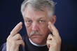 senior man crossing his fingers senior man crossing his fingers