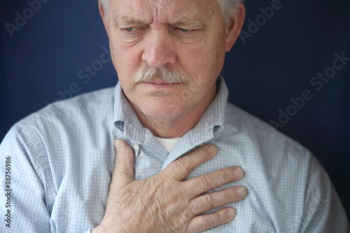 Photo: older man feeling pain in chest older man feeling pain in chest
