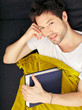 Tired Student With Blanket And Textbook