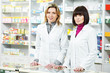 Photo: Two Pharmacy chemist women in drugstore Two Pharmacy chemist women in drugstore