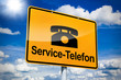 Ortseingangsschild mit Service-Telefon