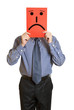 Photo: Man with the painted sad smile on the sheet of paper Man with the painted sad smile on the sheet of paper