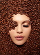 portrait of a girl's face drowned in coffee beans  brown makeup