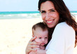 mother with her baby on the beach
