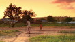 Children looking at the camera in Kenya at sunset.