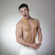 athletic man with tape measure