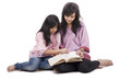 Photo: Mother and daughter read a book Mother and daughter read a book