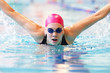 Photo: young woman swims the butterfly young woman swims the butterfly
