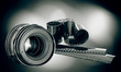 lens & film strip on dark background lens & film strip on dark background