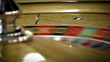 Close up of a roulette table spinning with the ball.