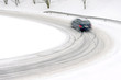 snowfall on the road, slippery way with car