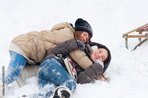 Photo: Beautiful teenage girls having fun in the snow Beautiful teenage girls having fun in the snow