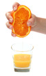 Photo: hand pour orange juice from orange hand pour orange juice from orange
