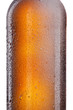 Beer bottle with water drops and frost isolated on white