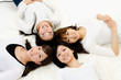 attractive asian women lying on the white carpet