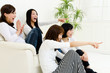 attractive asian women watching TV