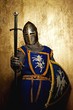 Medieval knight on golden background.