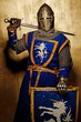 Medieval knight on golden background.