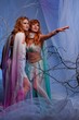 Elves in magical winter forest.