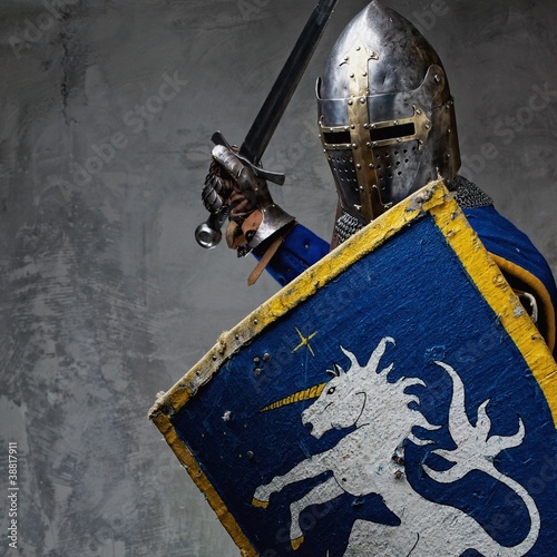 Photo: Medieval knight in attack position. Medieval knight in attack position.
