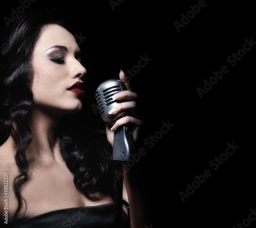Photo: Beautiful brunette woman singing Beautiful brunette woman singing
