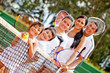 Tennis family by the net