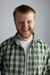Young man in a plaid shirt