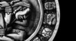 carved glyphs on a stone Mayan calendar