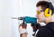 Photo: Man worker with drill Man worker with drill