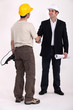 Architect and builder shaking hands