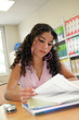 Teenage girl studying in the library