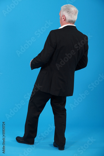Photo: Businessman leaning backwards Businessman leaning backwards