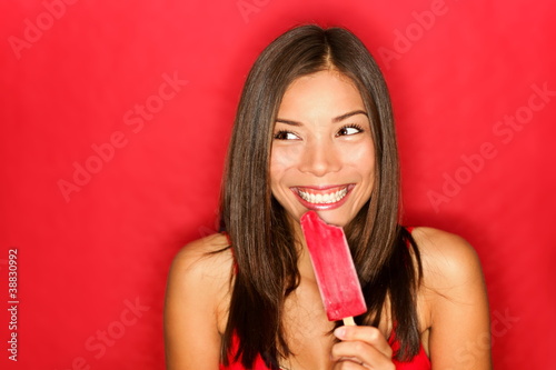 Photo: Girl eating ice popsicle Girl eating ice popsicle