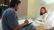 Red-haired women and male doctor in hospital