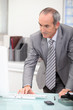 mature ceo working at office