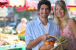 Foto: Couple shopping at local market Couple shopping at local market